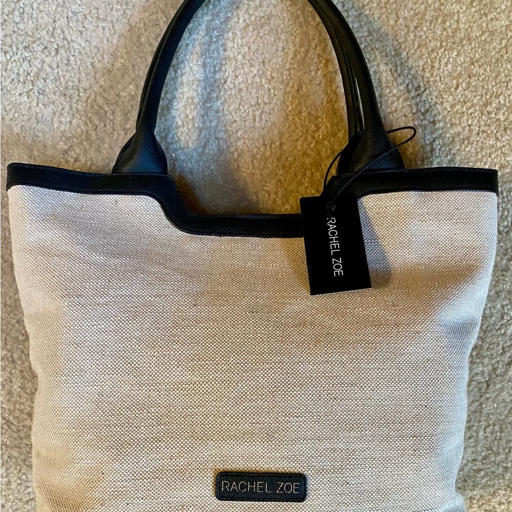 NWT Rachel Zoe handbag. Black and cream 3 inside pockets, one zipped
